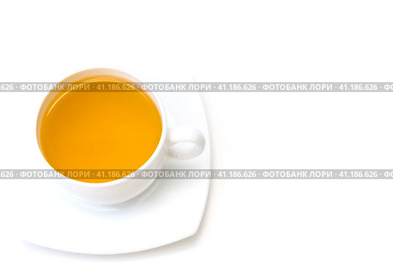 White porcelain cup with freshly brewed green tea isolated on white background. Top view. Selective focus. Белая фарфоровая чашка со свежезаваренным зеленым чаем, выделенная на белом фоне. Вид сверху. Избирательный фокус. Стоковое фото, фотограф Дмитрий Березнев / Фотобанк Лори