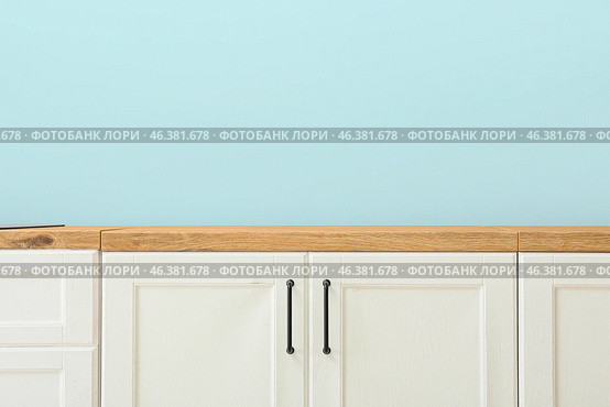 white wooden counters near blue wall. Стоковое фото, фотограф Pixel_shot / Фотобанк Лори