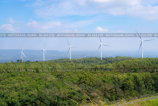 Wind turbines generating electricity on the hill in the countryside of Thailand. Стоковое фото, агентство Ingram Publishing / Фотобанк Лори