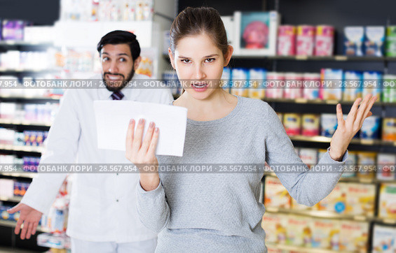woman client who is dissatisfied of recommended medicines. Стоковое фото, фотограф Яков Филимонов / Фотобанк Лори