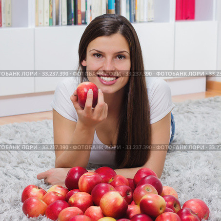 Woman Eating Apples. Стоковое фото, фотограф Mitar gavric / Smarterpix / Фотобанк Лори