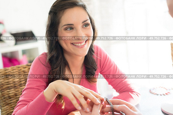 woman having her nails done. Стоковое фото, агентство Ingram Publishing / Фотобанк Лори