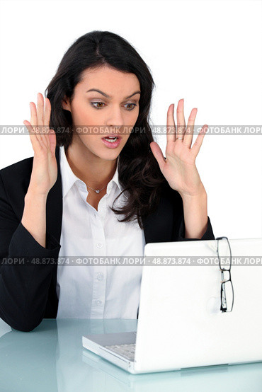 Woman having problem with computer. Стоковое фото, агентство Ingram Publishing / Фотобанк Лори