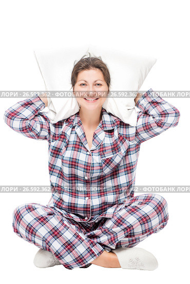 Woman in pajamas sitting on white background with pillow under head isolated. Стоковое фото, фотограф Константин Лабунский / Фотобанк Лори