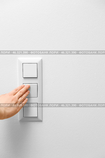 Woman switching on light at home, closeup. Стоковое фото, фотограф Pixel_shot / Фотобанк Лори