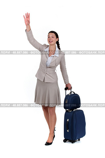 Woman waving goodbye. Стоковое фото, агентство Ingram Publishing / Фотобанк Лори