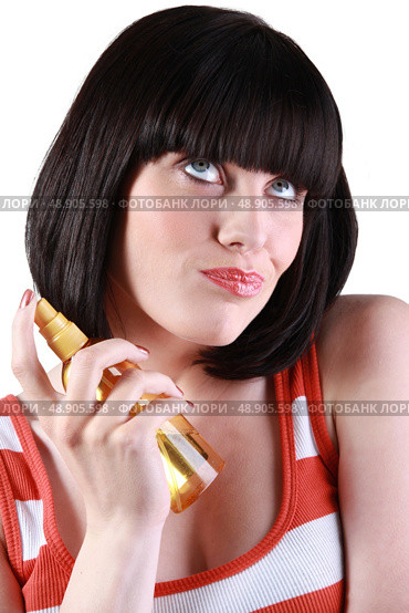 Woman with her finger on the nozzle of an aerosol. Стоковое фото, агентство Ingram Publishing / Фотобанк Лори
