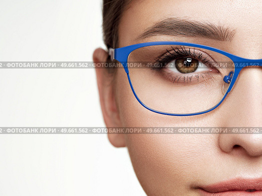 Woman with long eyelashes in eyeglasses. Vision correction. Poor eyesight. Spectacle frame. Makeup, cosmetics, beauty. Close up, macro. Стоковое фото, агентство Ingram Publishing / Фотобанк Лори