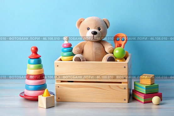 Wooden box with children's toys. A container with a teddy bear and educational wooden toys on a light blue background. Стоковое AI-изображение, AI-художник Photojuli / Фотобанк Лори