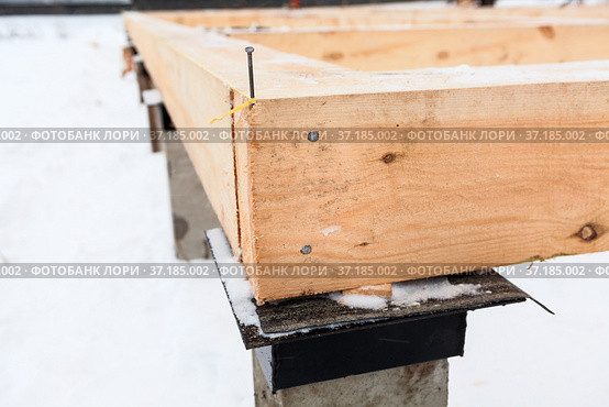 Wooden corner of piled foundation with timber framework beam. Стоковое фото, фотограф Кекяляйнен Андрей / Фотобанк Лори