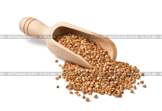 Wooden scoop with buckwheat isolated on white background. Стоковое фото, фотограф Катерина Ковалева / Фотобанк Лори