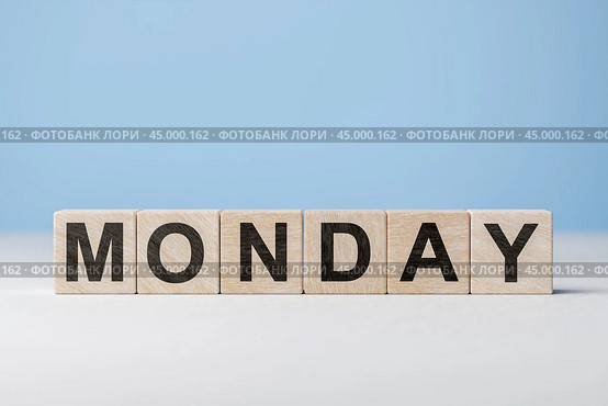 Word Monday on wooden cubes. Weekday concept. Monday inscription on wooden cubes on blue background. copy space. Стоковое фото, фотограф Павел Муравьев / Фотобанк Лори