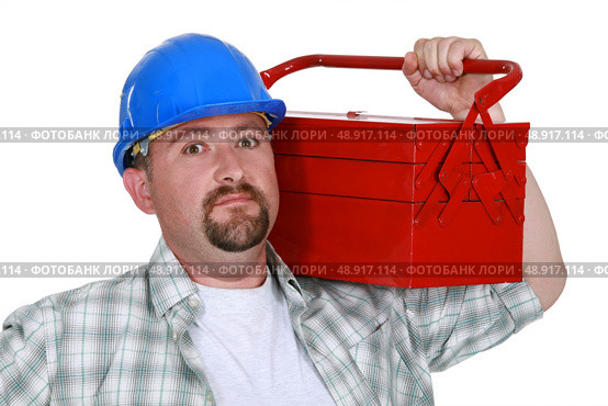 Worker holding too-box over shoulder. Стоковое фото, агентство Ingram Publishing / Фотобанк Лори
