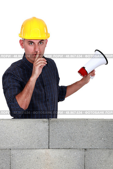 Worker with megaphone pleading silence. Стоковое фото, агентство Ingram Publishing / Фотобанк Лори