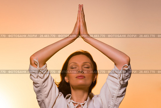 Yoga against the orange sky. Стоковое фото, фотограф Kirill Kedrinskiy / Ingram Publishing / Фотобанк Лори
