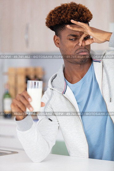 young african-american man with dairy allergy. Стоковое фото, агентство Ingram Publishing / Фотобанк Лори