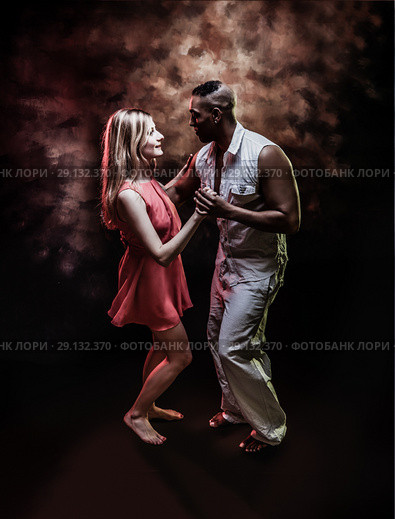 Young and sexy couple dances Caribbean Salsa. Стоковое фото, фотограф Игорь Бородин / Фотобанк Лори