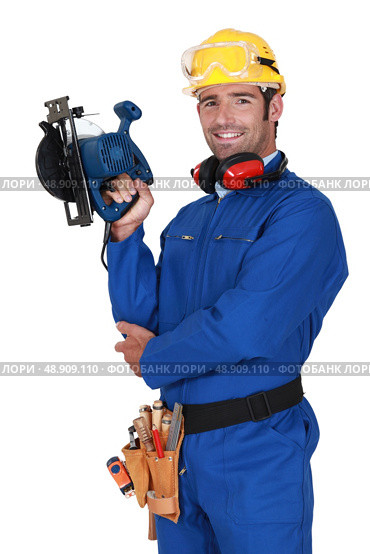 young blue collar with protective equipment and sander machine. Стоковое фото, агентство Ingram Publishing / Фотобанк Лори