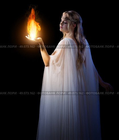 Young elven girl holding fire in palms isolated. Стоковое фото, агентство Ingram Publishing / Фотобанк Лори