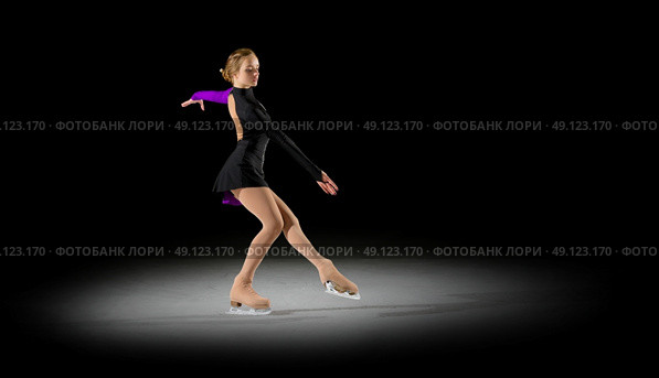 Young girl figure skater (half-isolated version) Стоковое фото, агентство Ingram Publishing / Фотобанк Лори