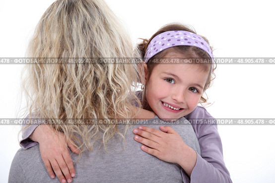 Young girl hugging her mother. Стоковое фото, агентство Ingram Publishing / Фотобанк Лори