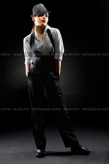 Young girl in manly style on black. Стоковое фото, агентство Ingram Publishing / Фотобанк Лори