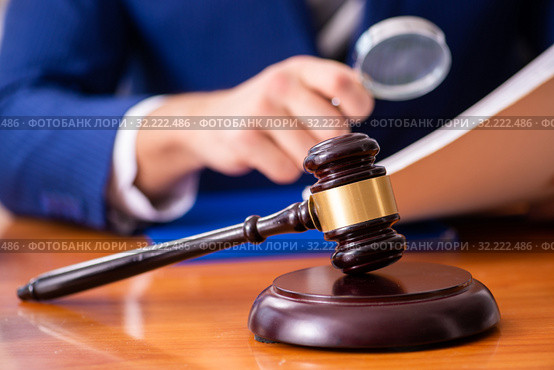 Young male judge sitting in courtroom. Стоковое фото, фотограф Elnur / Фотобанк Лори