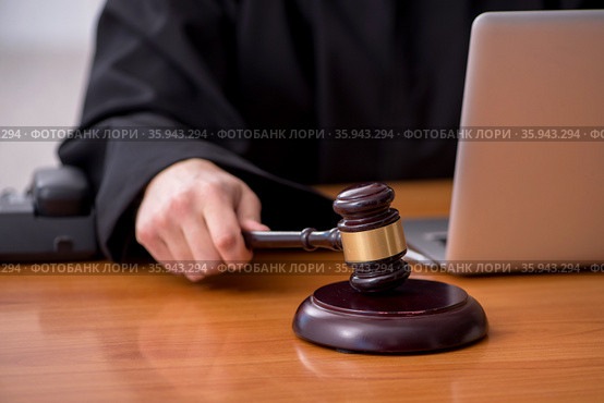 Young male judge working in the courtroom. Стоковое фото, фотограф Elnur / Фотобанк Лори