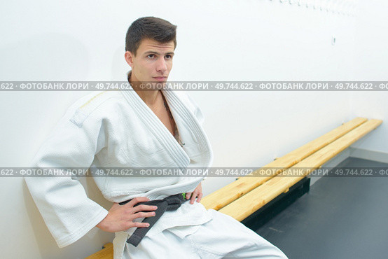 Young man in kimono in changing room. Стоковое фото, агентство Ingram Publishing / Фотобанк Лори