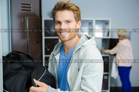 young man in sports changing room. Стоковое фото, агентство Ingram Publishing / Фотобанк Лори