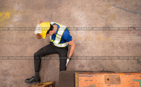 Young man working in a steel industry factory. He was critically hurt when a forklift ran over his leg and had to be transported to the hospital. Стоковое фото, агентство Ingram Publishing / Фотобанк Лори
