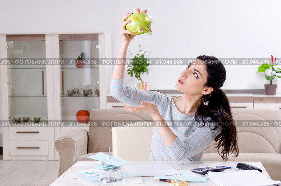 Young woman in budget planning concept. Стоковое фото, фотограф Elnur / Фотобанк Лори