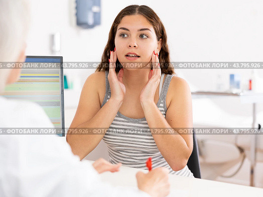 Young woman patient discussing face aesthetic procedures with a specialist. Стоковое фото, фотограф Яков Филимонов / Фотобанк Лори