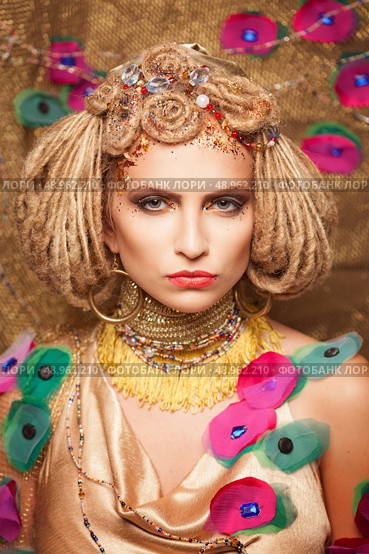 young woman with fashion makeup on brown background. Стоковое фото, агентство Ingram Publishing / Фотобанк Лори