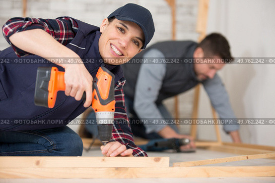 young woman worker in the carpenter workroom. Стоковое фото, агентство Ingram Publishing / Фотобанк Лори