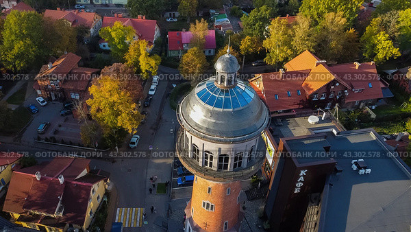 Zelenogradsk, Russia - October 9, 2022: water tower Cranz top ariel view. Редакционное фото, фотограф Наталья Симакова / Фотобанк Лори
